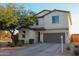 Beautiful two-story home with a landscaped front yard, and a spacious two-car garage at 1100 S 176Th Ave, Goodyear, AZ 85338