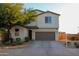 Charming home with a well-manicured front yard, a two-car garage, and a welcoming entrance at 1100 S 176Th Ave, Goodyear, AZ 85338