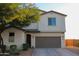 Charming two-story home featuring a two-car garage and well-manicured front yard at 1100 S 176Th Ave, Goodyear, AZ 85338