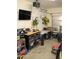 Well-organized garage with ample storage, a workstation, and a television at 1100 S 176Th Ave, Goodyear, AZ 85338