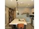 Bright kitchen island with seating and decor, stainless steel appliances and designer wall art at 1100 S 176Th Ave, Goodyear, AZ 85338