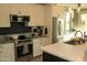 Kitchen features a spacious island, stainless steel appliances, and granite countertops at 1100 S 176Th Ave, Goodyear, AZ 85338
