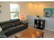 Upstairs living room with comfortable leather sofa and lots of natural light at 1100 S 176Th Ave, Goodyear, AZ 85338