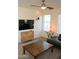 Cozy living room with hardwood table, mounted television and lots of natural light at 1100 S 176Th Ave, Goodyear, AZ 85338