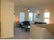 Upstairs living room featuring plush black leather seating and natural lighting at 1100 S 176Th Ave, Goodyear, AZ 85338