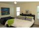 Bright main bedroom with comfortable bed, modern furniture and decorations at 1100 S 176Th Ave, Goodyear, AZ 85338