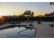Scenic backyard with a serene pool, stylish lounge chairs and meticulously designed landscaping at 1100 S 176Th Ave, Goodyear, AZ 85338