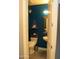 Cozy powder room with unique decor, including a floating sink, modern toilet, and decorative wall art at 1100 S 176Th Ave, Goodyear, AZ 85338