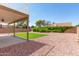 Backyard patio area with nice rock landscaping at 1202 E Libby St, Phoenix, AZ 85022