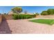 Backyard patio area with lush landscaping at 1202 E Libby St, Phoenix, AZ 85022