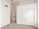 Carpeted bedroom featuring neutral walls and a closet with sliding doors at 1202 E Libby St, Phoenix, AZ 85022