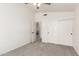Bedroom with carpet, ceiling fan, and an open door to the hallway at 1202 E Libby St, Phoenix, AZ 85022
