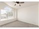 Neutral bedroom featuring a large window and carpeted floors at 1202 E Libby St, Phoenix, AZ 85022