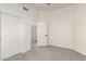 Bedroom featuring carpeted floors, neutral walls, and sliding closet doors at 1202 E Libby St, Phoenix, AZ 85022