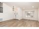 Bright entryway featuring wood-look floors, double front door, and modern light fixture at 1202 E Libby St, Phoenix, AZ 85022