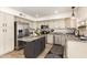 A bright kitchen featuring stainless steel appliances, granite countertops, and a center island at 1202 E Libby St, Phoenix, AZ 85022