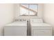 Well-lit laundry area includes modern washer and dryer at 1202 E Libby St, Phoenix, AZ 85022