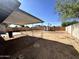 Expansive backyard includes a covered patio, providing shade for outdoor relaxation and enjoying the scenery at 1214 E Henry St, Tempe, AZ 85288