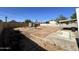 Spacious backyard offers endless possibilities for outdoor entertaining and recreation under the clear blue sky at 1214 E Henry St, Tempe, AZ 85288