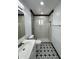 Updated bathroom with stylish tile floor, modern fixtures, and well-lit shower at 1214 E Henry St, Tempe, AZ 85288