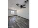 Bedroom features modern ceiling fan, laminate flooring, fresh paint, and ample natural light at 1214 E Henry St, Tempe, AZ 85288