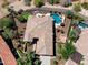 An aerial view of the property with a private backyard, swimming pool, spa, putting green, and desert landscaping at 13072 W Alyssa Ln, Peoria, AZ 85383