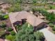 An elevated view shows a desert home with a three car garage, mature trees, and desert landscaping at 13072 W Alyssa Ln, Peoria, AZ 85383