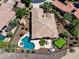 Aerial view showcases a private backyard with a pool, spa, putting green, and well-maintained landscaping at 13072 W Alyssa Ln, Peoria, AZ 85383