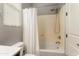 Bathroom with a shower and tub combination and a white shower curtain at 13072 W Alyssa Ln, Peoria, AZ 85383