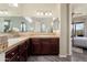 Bathroom features a double sink vanity and views into the main bedroom at 13072 W Alyssa Ln, Peoria, AZ 85383