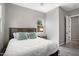 Bedroom with a gray accent wall, window and a light-colored, cozy carpet at 13072 W Alyssa Ln, Peoria, AZ 85383