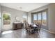 Dining room with a round table, sideboard and large windows offering scenic views at 13072 W Alyssa Ln, Peoria, AZ 85383