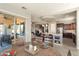 Open-concept kitchen and dining area with a round table and sliding glass doors leading to the patio at 13072 W Alyssa Ln, Peoria, AZ 85383