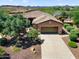 Aerial view of a home with a spacious driveway, desert landscaping, and a two-car garage at 13072 W Alyssa Ln, Peoria, AZ 85383