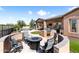 Outdoor fire pit with seating area, BBQ kitchen, and putting green at 13072 W Alyssa Ln, Peoria, AZ 85383