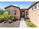 Inviting front entrance with desert landscaping, shuttered windows, and a paved walkway at 13072 W Alyssa Ln, Peoria, AZ 85383