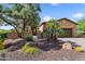 Charming home exterior with desert landscaping, a two-car garage, and a cozy front yard at 13072 W Alyssa Ln, Peoria, AZ 85383