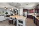 Well-equipped kitchen featuring an island, breakfast bar and stainless steel appliances at 13072 W Alyssa Ln, Peoria, AZ 85383