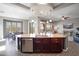 Spacious kitchen featuring a granite island, breakfast bar seating, stainless steel appliances and open-concept design at 13072 W Alyssa Ln, Peoria, AZ 85383