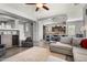 Open-concept floor plan showcasing the living room and kitchen with modern furnishings and stylish decor at 13072 W Alyssa Ln, Peoria, AZ 85383