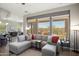 Comfortable living room with stylish furnishings, abundant natural light, and seamless indoor-outdoor flow at 13072 W Alyssa Ln, Peoria, AZ 85383