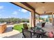 Covered patio with outdoor dining area and built in BBQ, and putting green at 13072 W Alyssa Ln, Peoria, AZ 85383