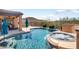 Inviting pool and spa with beautiful mountain views and covered outdoor seating area at 13072 W Alyssa Ln, Peoria, AZ 85383