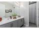 Bright bathroom featuring a double sink vanity, modern fixtures, and a neutral color scheme at 14360 W Windrose Dr, Surprise, AZ 85379