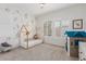 bedroom with playhouse and leafy wallpaper at 14360 W Windrose Dr, Surprise, AZ 85379