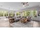 Open-concept living room and dining area filled with natural light and stylish decor at 14360 W Windrose Dr, Surprise, AZ 85379