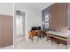 Office featuring a desk, keyboard and wood paneled accent wall at 14360 W Windrose Dr, Surprise, AZ 85379