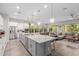 A kitchen that opens to the dining room and living room, perfect for entertaining at 14360 W Windrose Dr, Surprise, AZ 85379