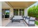 Cozy covered patio featuring outdoor furniture, perfect for relaxing or entertaining guests at 14360 W Windrose Dr, Surprise, AZ 85379