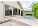 View of the backyard featuring a small pool with tile surround and a decorative water feature at 14360 W Windrose Dr, Surprise, AZ 85379